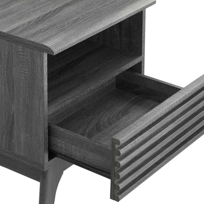 Black wood nightstand with open shelf and grooved-front drawer; tapered legs.
