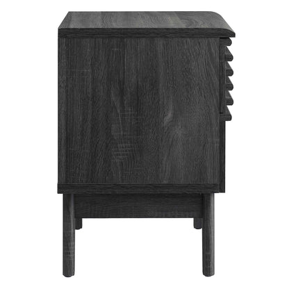 Dark charcoal wood nightstand on legs with a right-side built-in wine rack and smooth front.