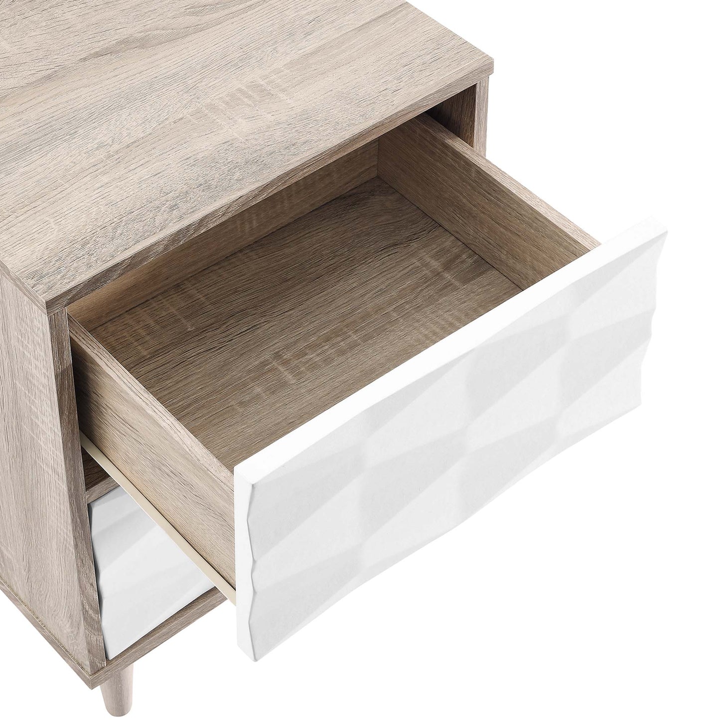 Light oak wood two-drawer bedside table with white diamond-textured fronts; top drawer open to reveal natural wood interior.