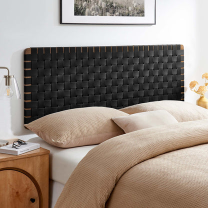 Woven black headboard with walnut edge accents, beige duvet and matching pillows in a modern bedroom.
