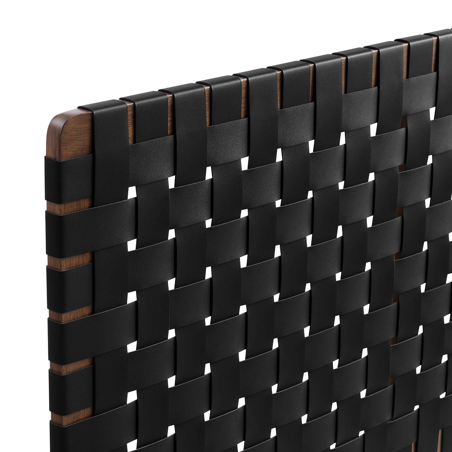 Close-up of a walnut wood-framed headboard with a black vegan leather weave in a grid pattern.