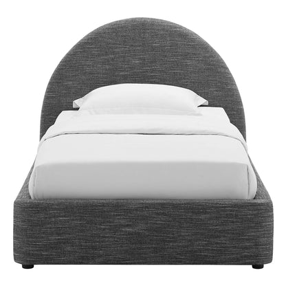 Grey fabric upholstered bed with an arched headboard and white sheets and pillows.