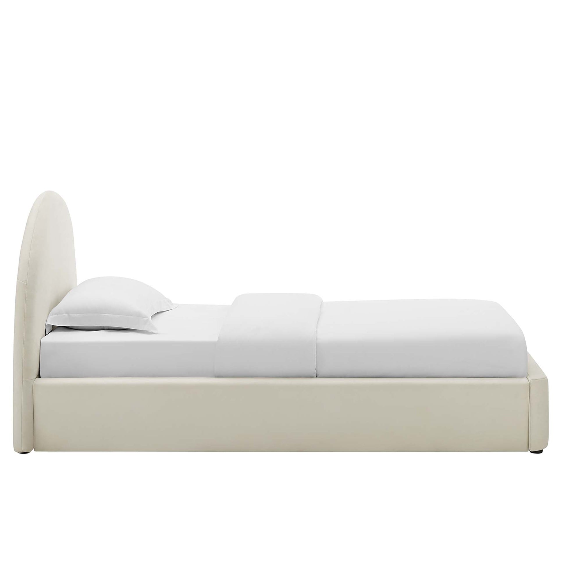 White velvet upholstered platform bed with an arched headboard and white bedding; contemporary minimalist design.