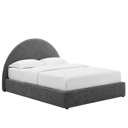 Grey upholstered platform bed with a tall curved arch headboard, white bedding and two pillows.