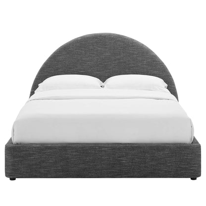 Grey fabric upholstered platform bed with a rounded arched headboard and white bedding.