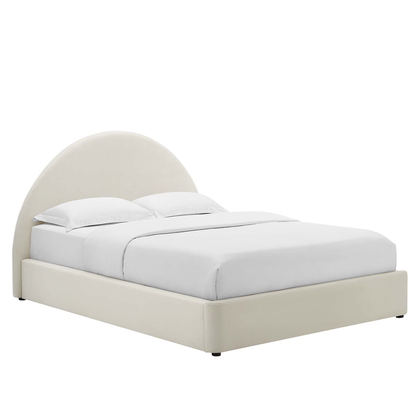 White upholstered platform bed with a rounded arched headboard and white bedding.