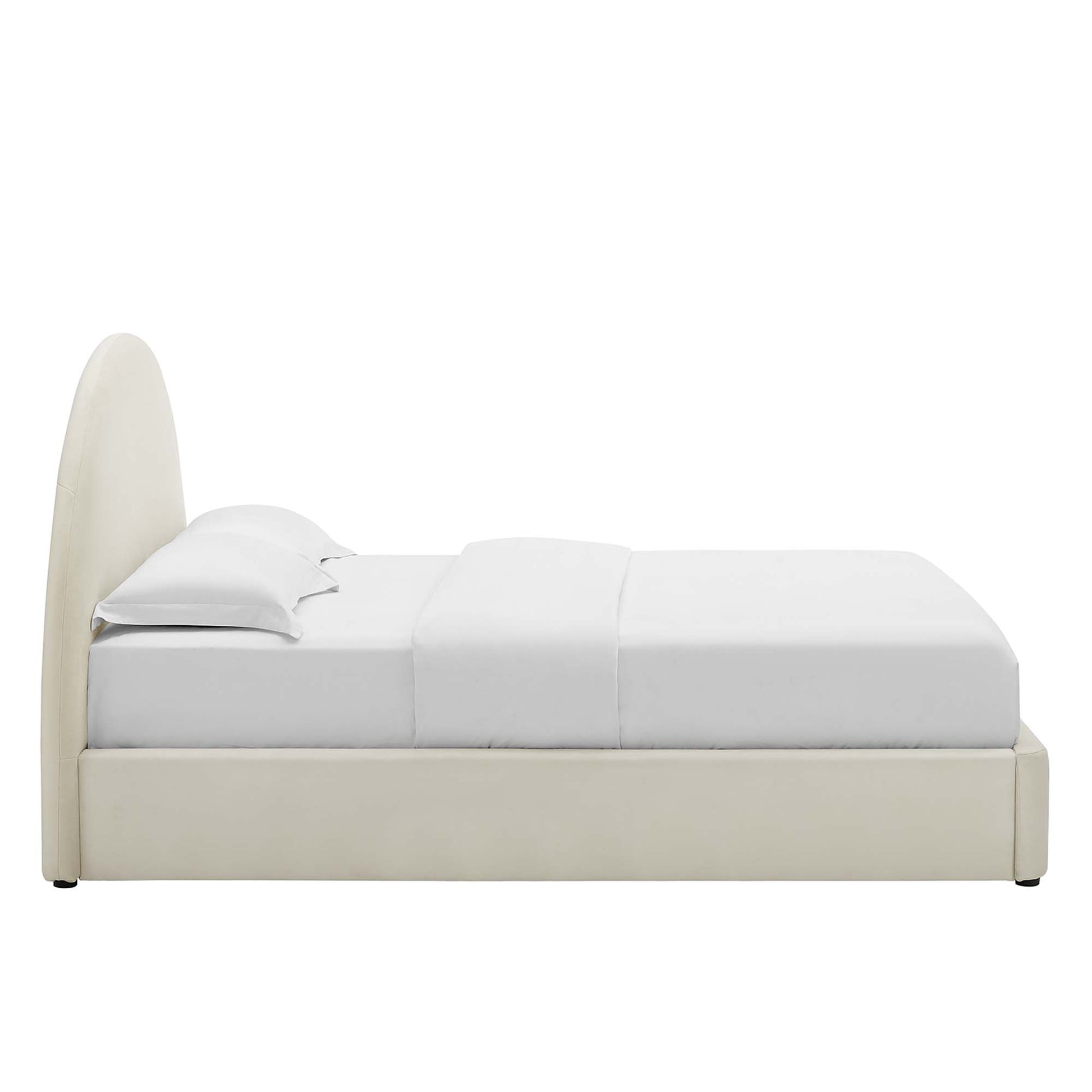 White upholstered full platform bed with an arched round headboard and white bedding.