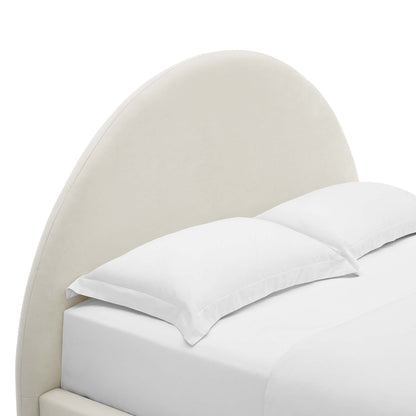 White curved upholstered headboard bed with white linens and pillows, arched round full platform bed, contemporary bedroom centerpiece.