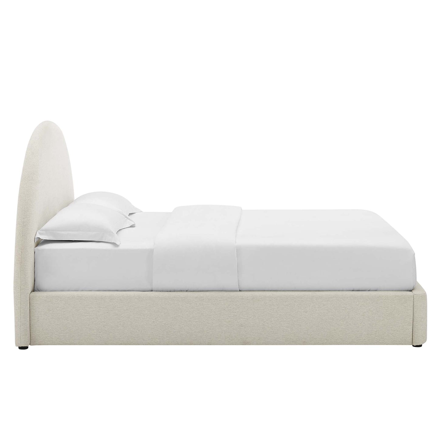 White upholstered queen platform bed with an arched round headboard & white sheets & pillows.