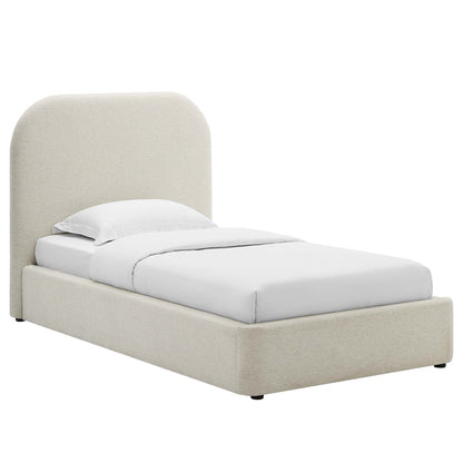White upholstered platform bed with tall curved headboard and white linens, modern bedroom style.