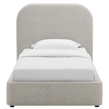 Gray upholstered twin platform bed with curved headboard and low footboard, white bedding.