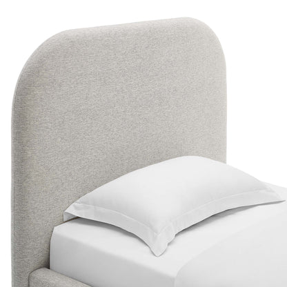 Light gray fabric upholstered curved headboard bed with white pillow and sheets.