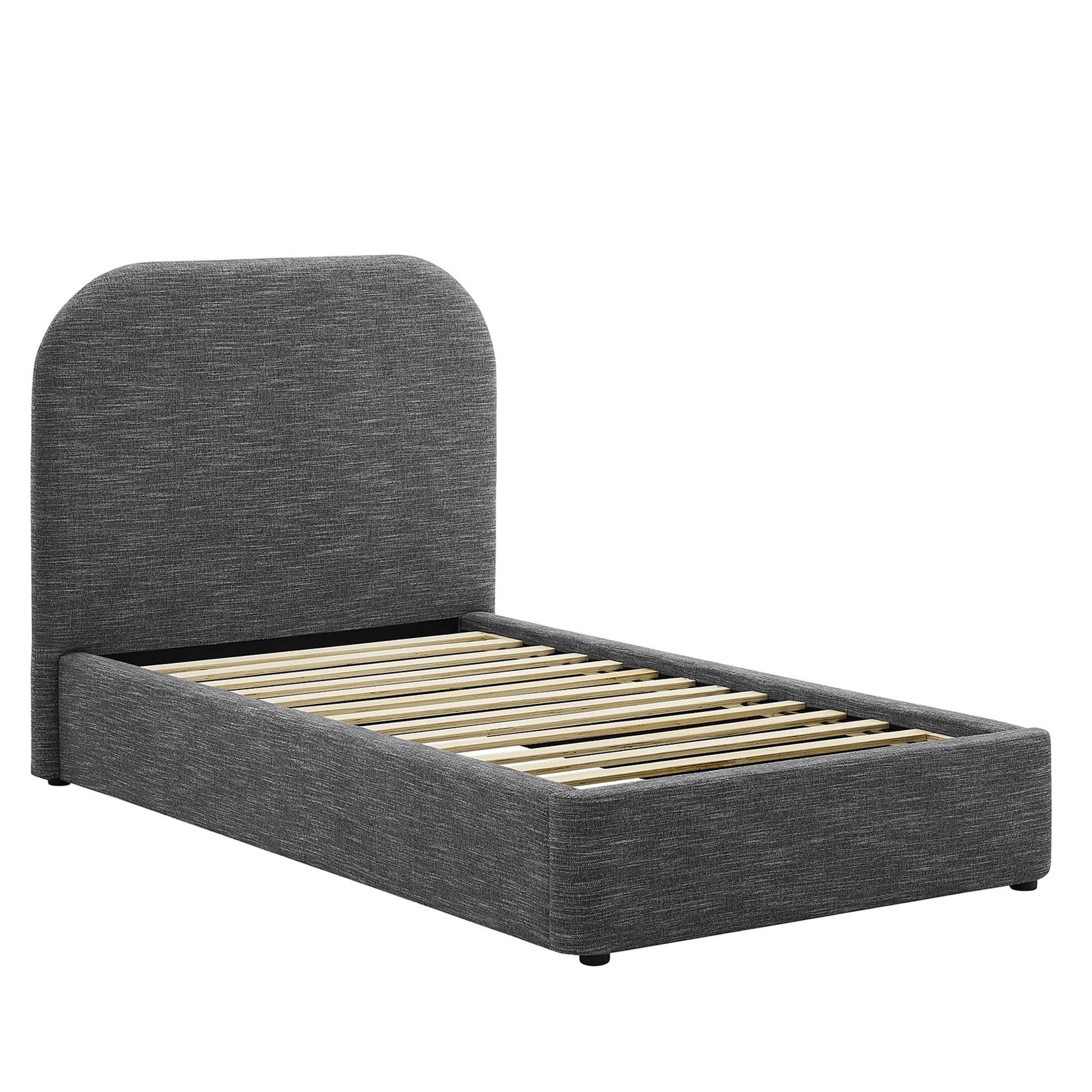 Grey fabric upholstered twin platform bed with curved headboard and wooden slat support.