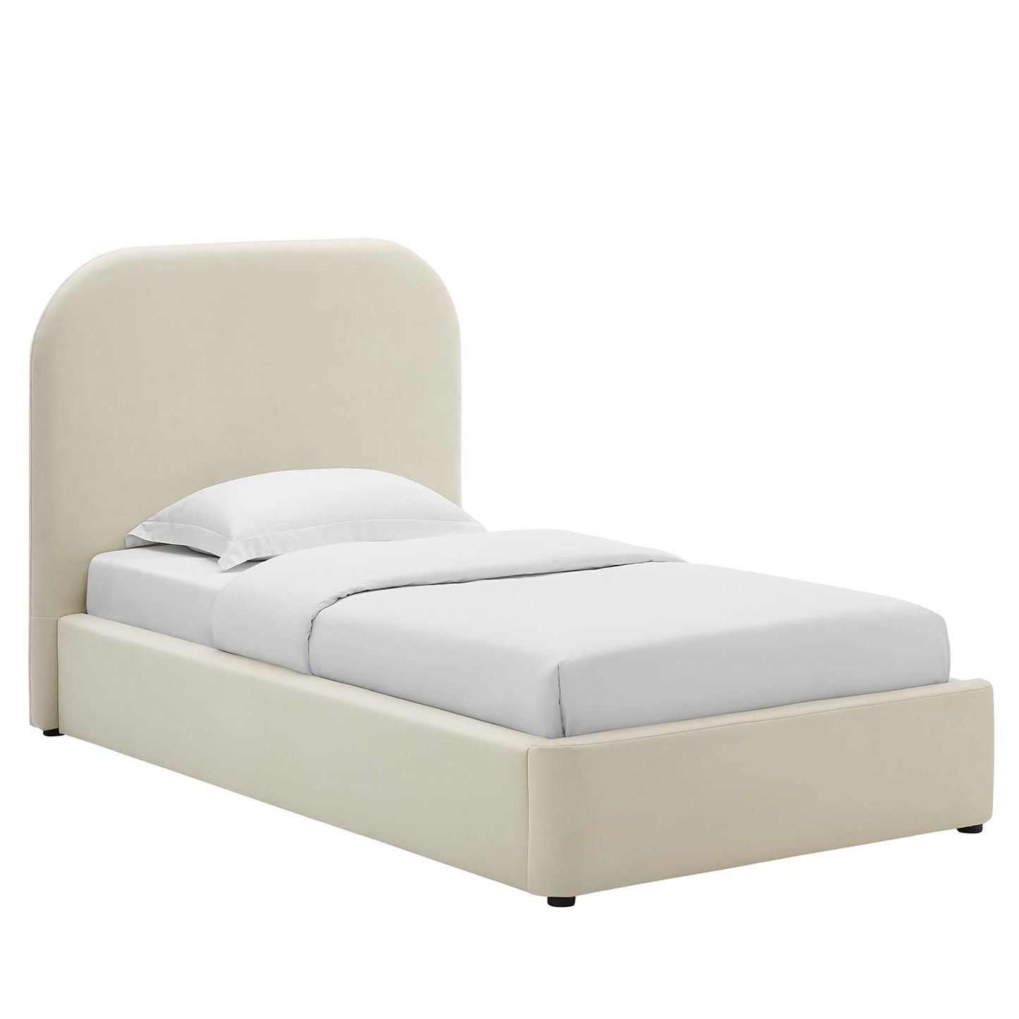 White upholstered twin platform bed with a curved headboard and white bedding.