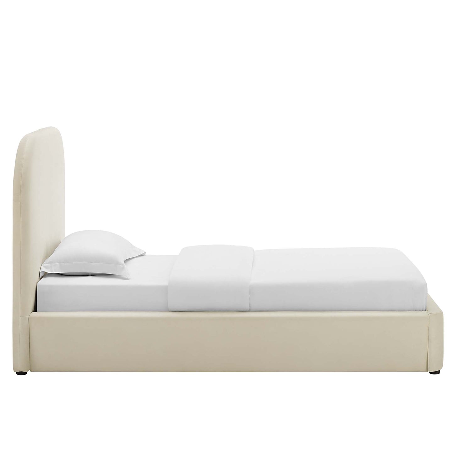 White upholstered platform bed with a tall padded headboard and white bedding.