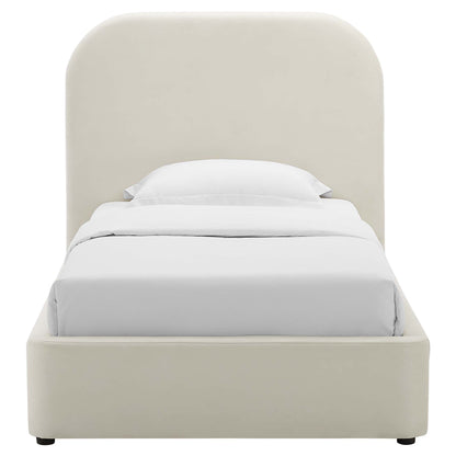 White upholstered platform bed with a curved padded headboard and white bedding.