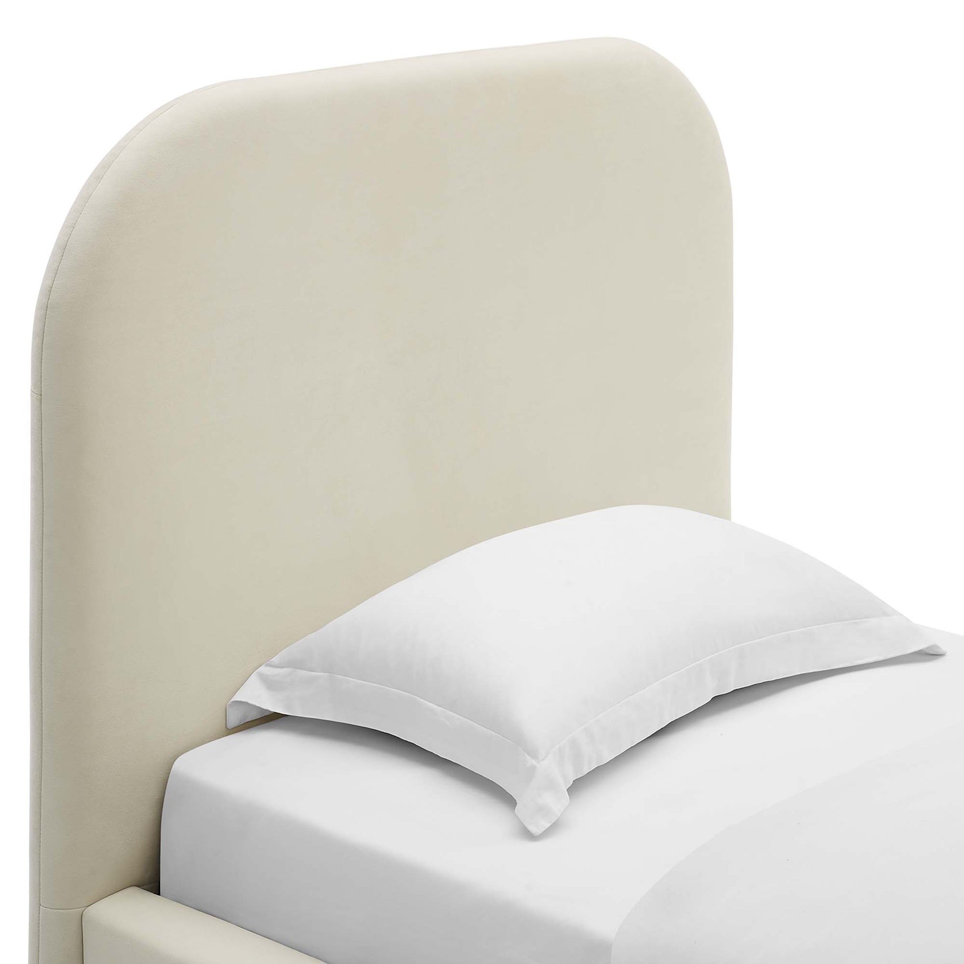 White twin platform bed with a curved upholstered headboard and white bedding in a modern minimalist bedroom setup.