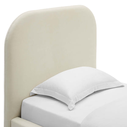 White twin platform bed with a curved upholstered headboard and white bedding in a modern minimalist bedroom setup.