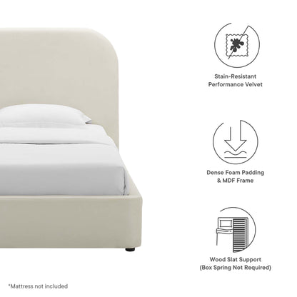 Beige upholstered bed with curved headboard; stain-resistant velvet, dense foam padding & MDF frame, wood slat support.