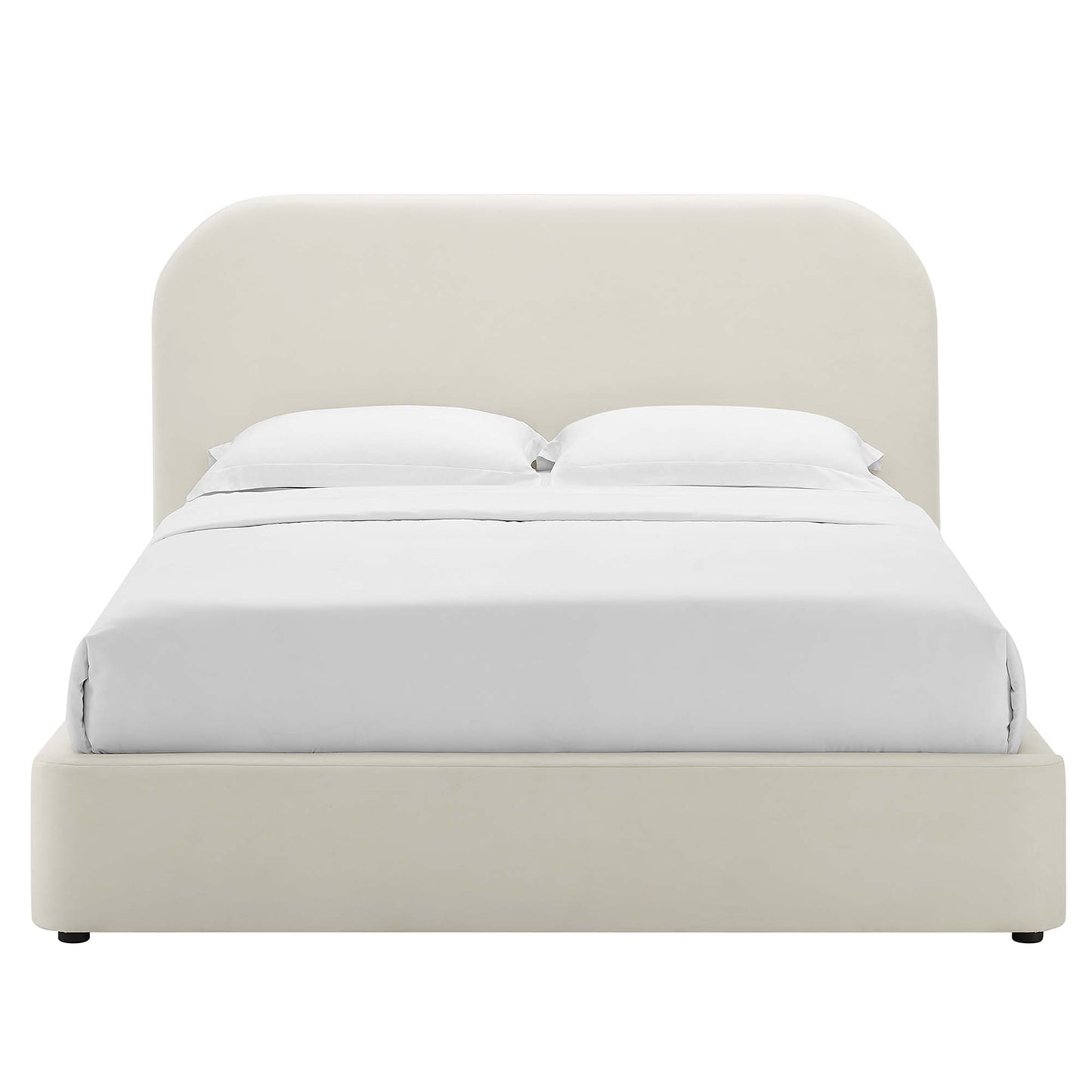 Cream fabric upholstered platform bed with a rounded arch headboard and white sheets.