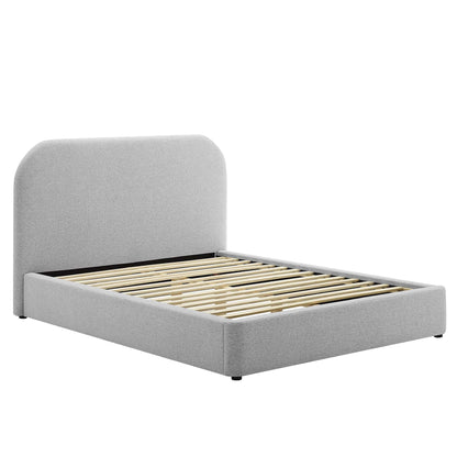Light gray upholstered platform bed with rounded headboard and wooden slatted base.