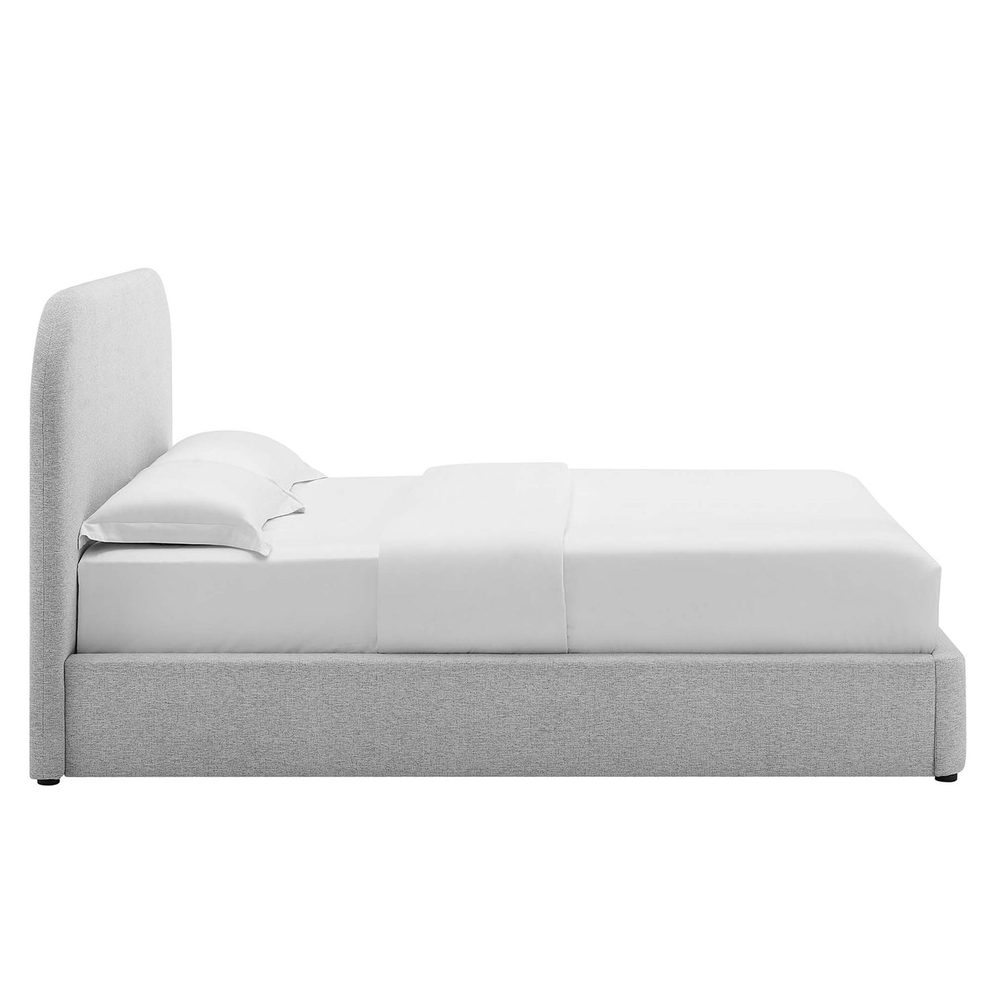 Gray fabric platform bed with tall curved headboard and white sheets, pillows, and comforter.