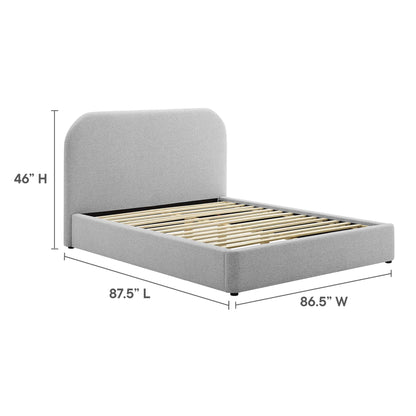 Grey upholstered platform bed with tall curved headboard and visible wooden slats.