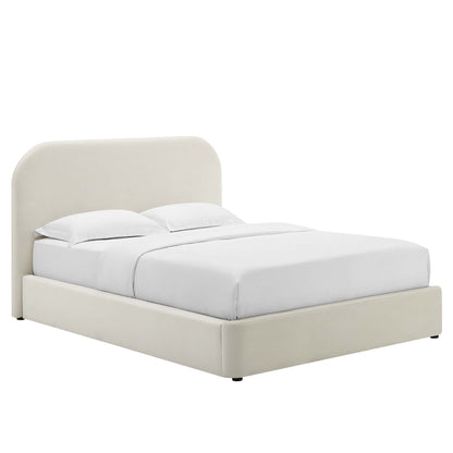 Beige fabric upholstered platform bed with rounded headboard and white bedding.