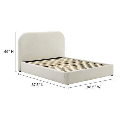 White upholstered king platform bed with a 46" tall curved headboard and slatted base; modern bedroom style.