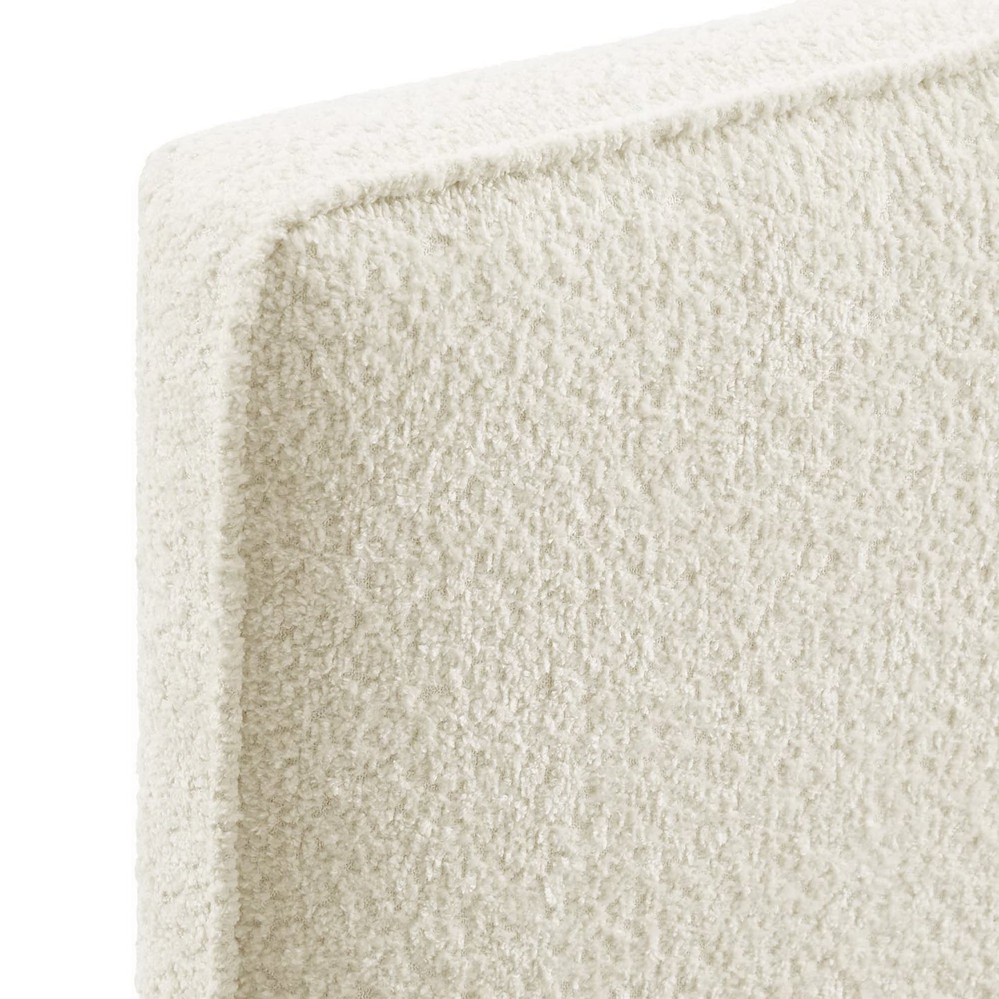 Yellow boucle fabric twin headboard; close-up of textured upholstery.
