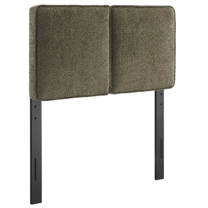 Two green padded boucle fabric panels form a twin headboard on a black metal frame.