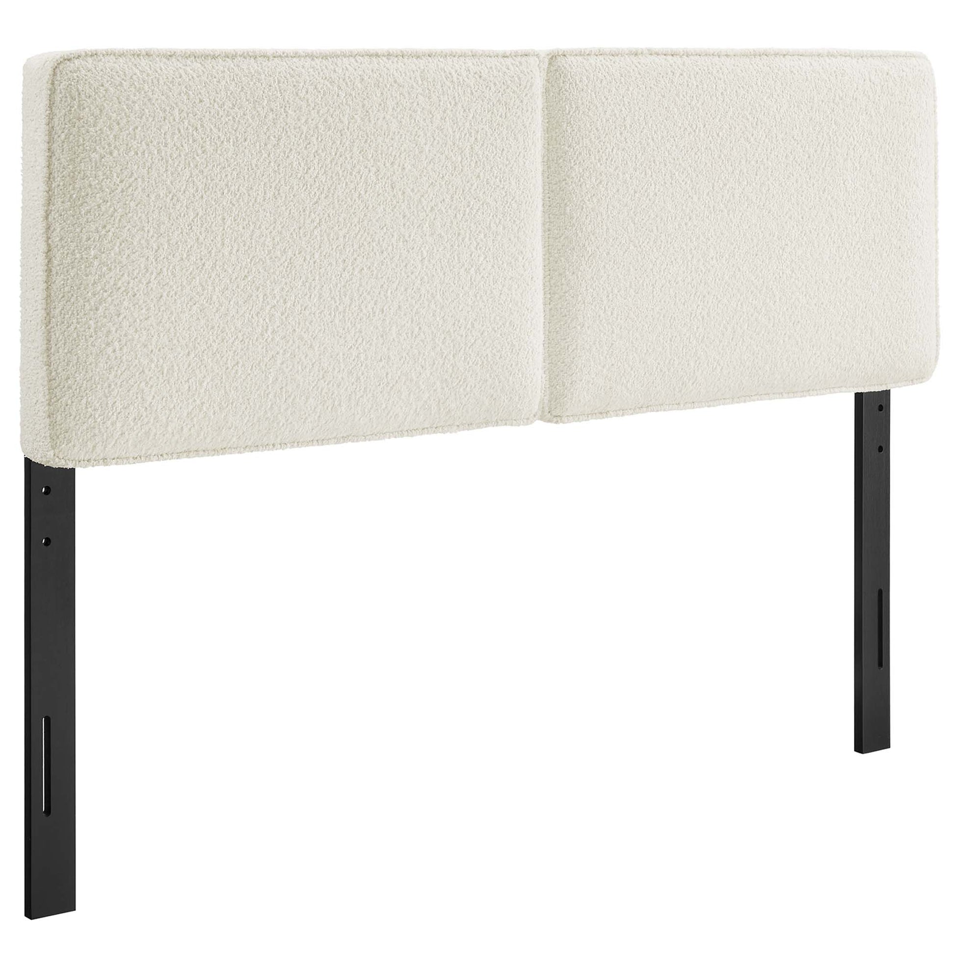 Cream boucle two-panel freestanding upholstered headboard with black metal legs for a modern minimalist bedroom.