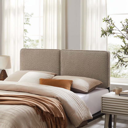 Beige two-panel upholstered headboard in a sunlit modern bedroom, with oat bedding, tan throw, and matching pillows.