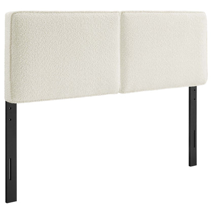 Cream two-panel headboard in boucle fabric on black metal legs; modern minimalist design.