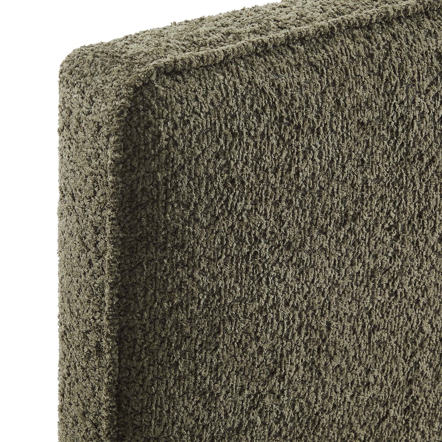 Close-up of sage-brown boucle fabric on a rectangular headboard with a soft, fuzzy, chunky pile.