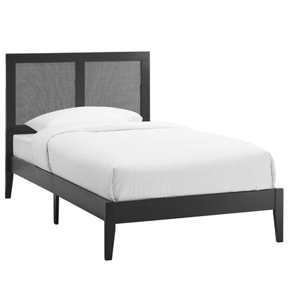 Black modern platform bed with a two-panel woven headboard and white bedding.