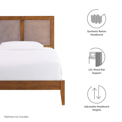 Walnut wood bed frame with a woven synthetic rattan headboard and white bedding.