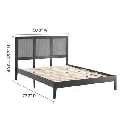 Black platform bed with a three-panel woven headboard, dark frame, and wooden slats.