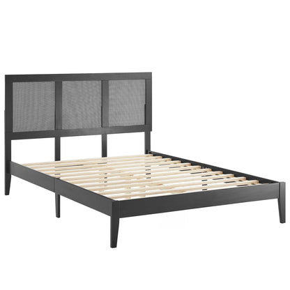 Black full platform bed with a three-panel rattan & wood headboard and wooden slat support.