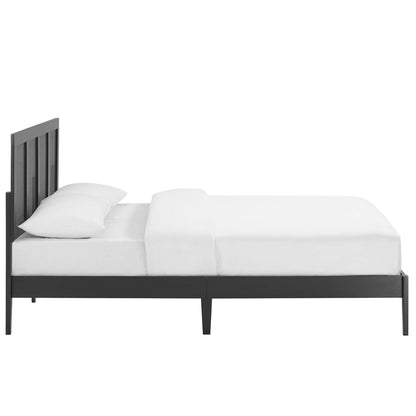 Black metal platform bed with vertical slat headboard, low-profile frame in a modern minimalist style with white bedding.