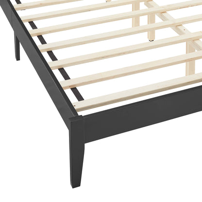 Black queen platform bed with wood slats and rattan accents, featuring a low-profile footboard and straight legs.