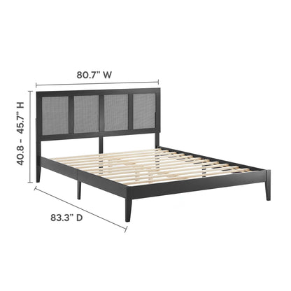 Black metal bed frame with tall four-panel upholstered headboard, slatted wooden foundation, platform style.