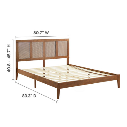 Walnut-finish king platform bed with rattan and wood elements, paneled headboard and slatted foundation