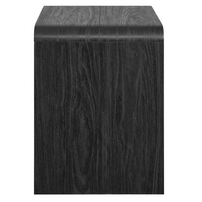 Dark wood nightstand with curved top edge and 1 drawer, black finish.