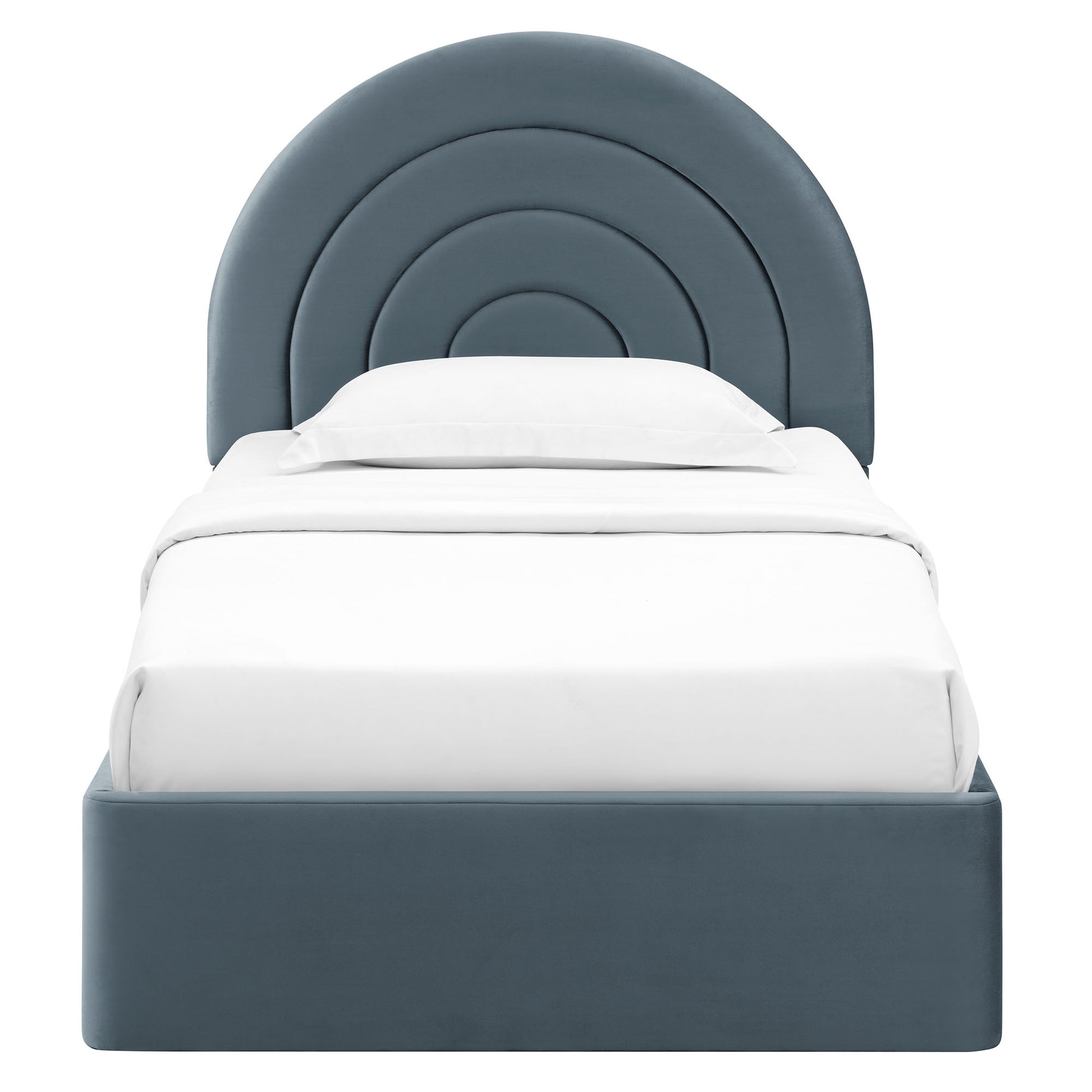 Blue-gray upholstered bed with a concentric arc headboard and white bedding.