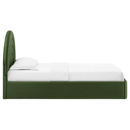 Green upholstered platform bed with a curved arched headboard and white bedding.