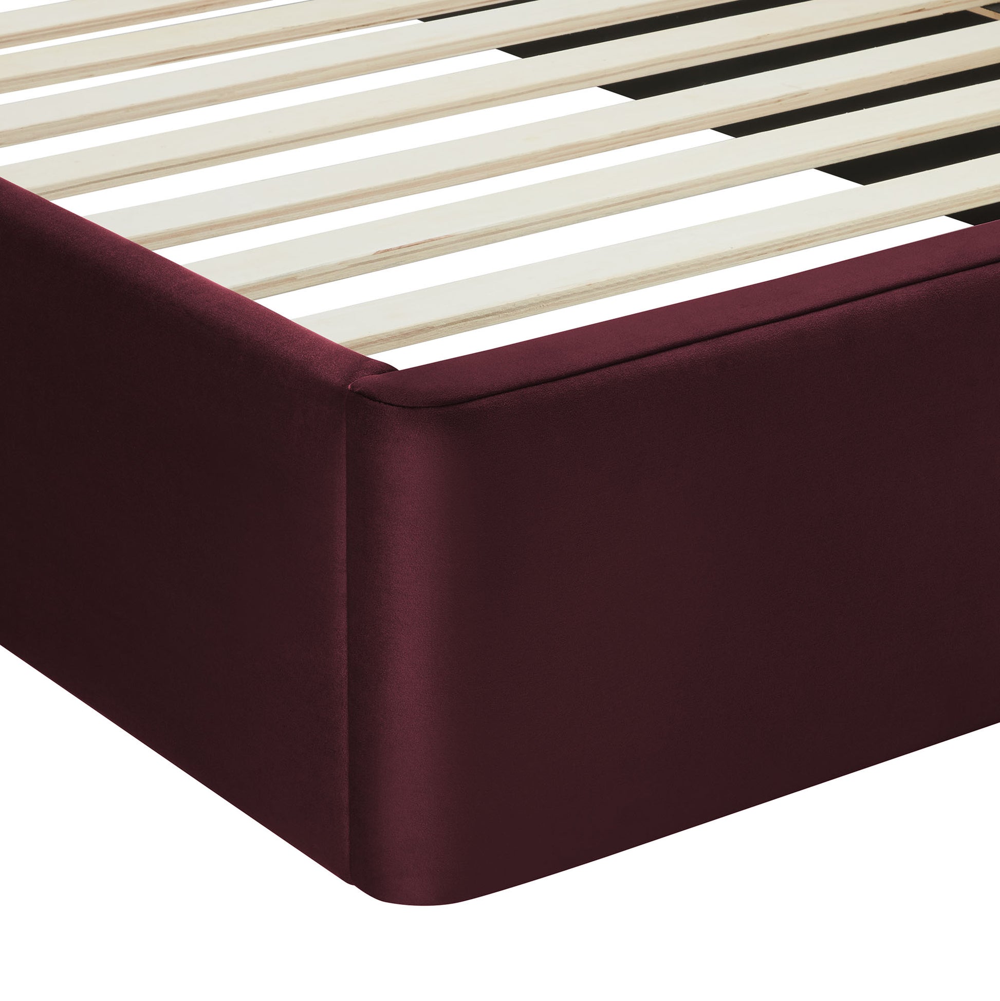 Burgundy upholstered platform bed frame with light wood slats and rounded corner.