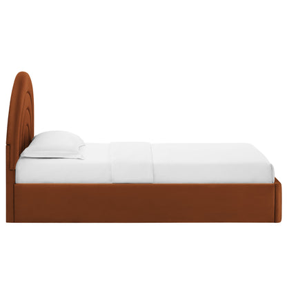 Rust brown velvet twin platform bed with an arched headboard and white bedding.