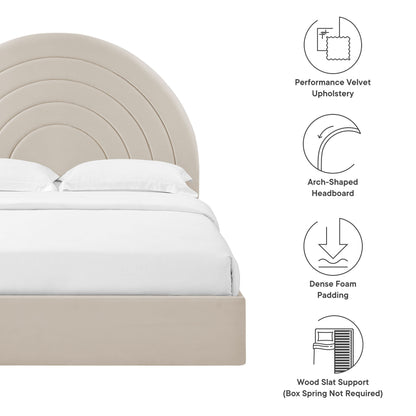 Beige upholstered bed with arch-shaped, concentric arc headboard and white bedding; modern velvet look.
