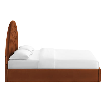 Brown velvet full platform bed with a tall, arched upholstered headboard and white bedding.